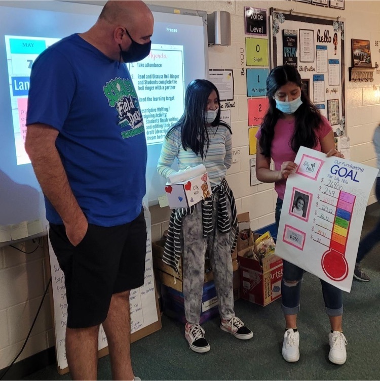 newcomer students describe their fundraiser to Mr. Comley